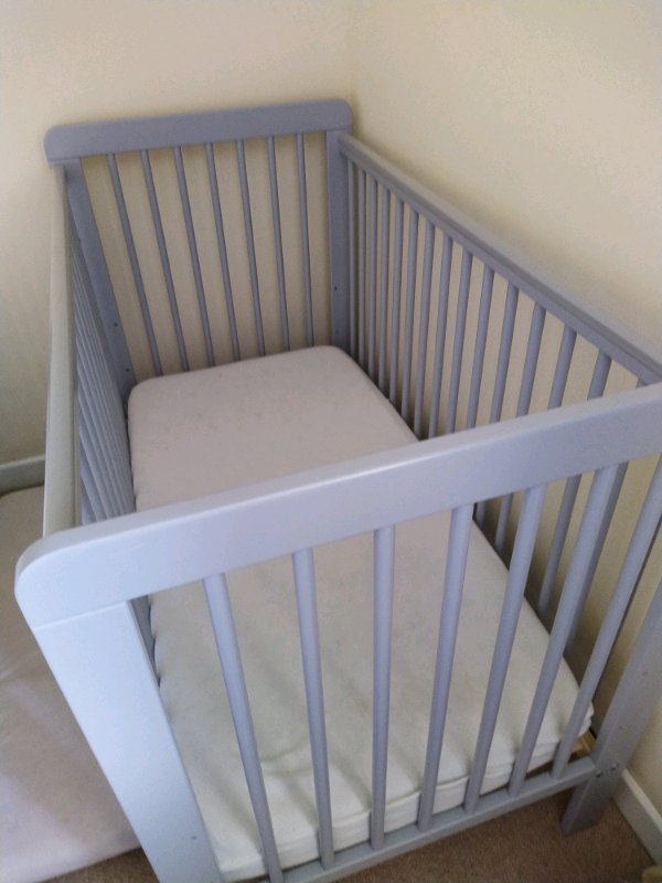 small grey cot